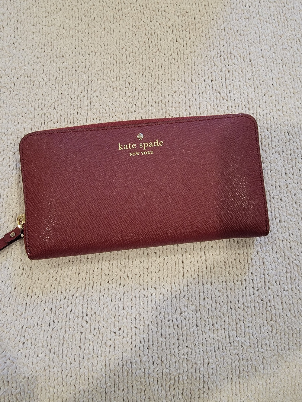kate spade burgundy zip wallet with gold logo